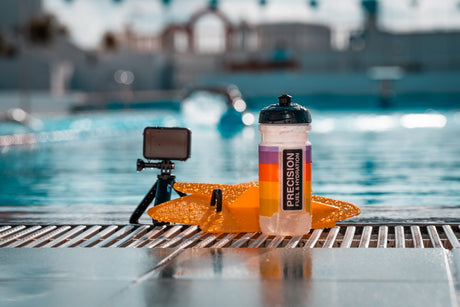 Precision Fuel & Hydration 500ml water bottle on pool edge