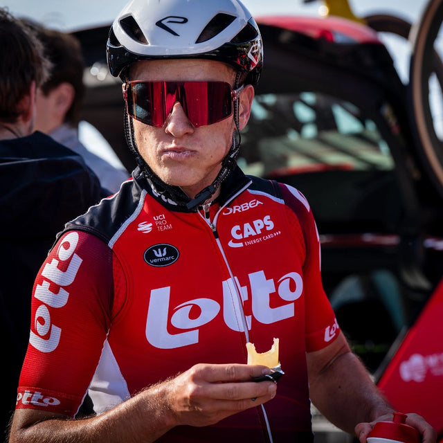 Athlete eating a Precision Fuel 60 chew bar