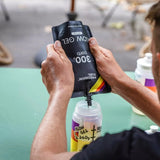 Filling a water bottle with Precision Fuel flow gel