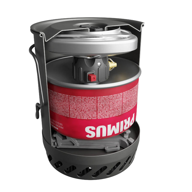Cutaway view of a Primus portable camping stove system with fuel and stove packed inside pot