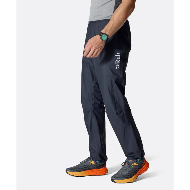 Side on-model view of black Rab Phantom waterproof pants