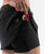 Side pocket view of women's black rabbit empower skort