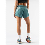 Back on-model view of rabbit running FKT 4" shorts in Hydro colour