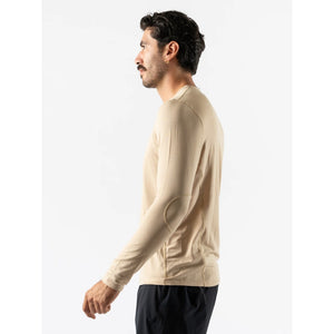 Side on-model view of men's cream coloured Rabbit Layer One base layer long sleeve