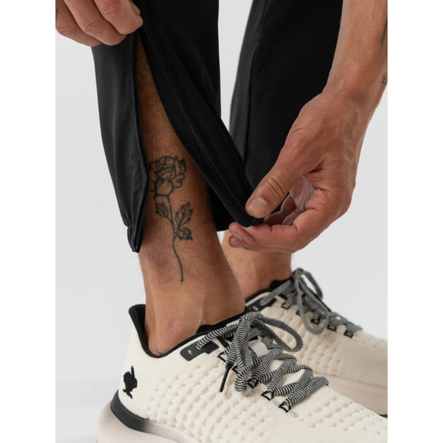 Ankle zipper detail of men's black rabbit runners joggers