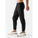 Side on-model view of men's black rabbit runners joggers