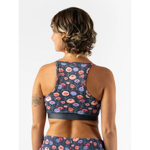 Back view of rabbit running strappy pocket bra in 'eclipse poppy' pattern