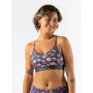 Front view of rabbit running strappy pocket bra in 'eclipse poppy' pattern