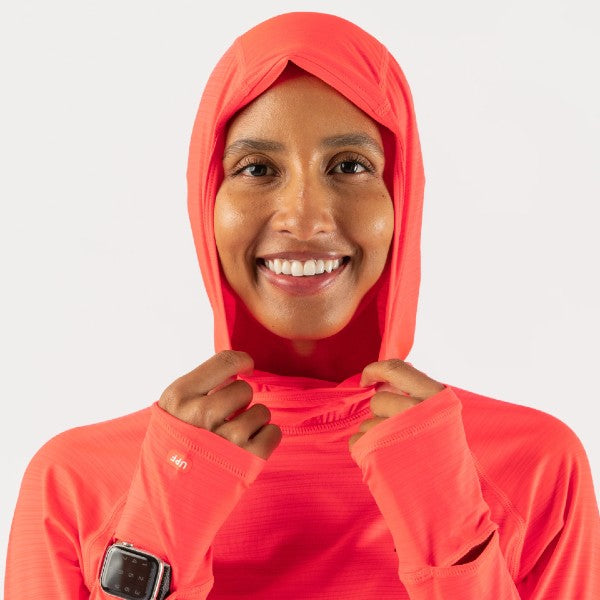Hood detail of women's rabbit UPF Deflector 2.0 pullover in fiery coral