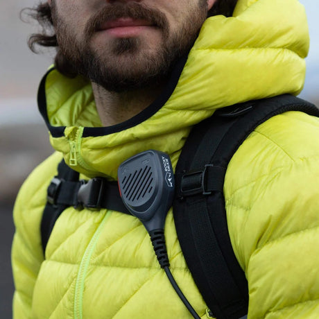 Rocky Talkie hand mic attached to a backpack chest strap