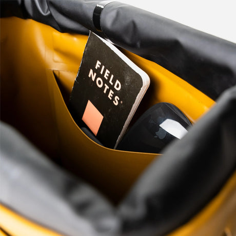Field notes notebook inside the RUX waterproof 15L tote bag