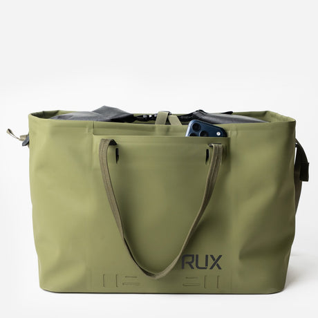 Green RUX waterproof 50L tote bag straps down