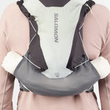 Back on-model view of green/grey Salomon ADV Skin 12 running vest