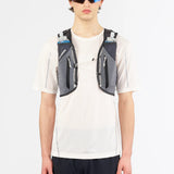 Front on-model view of green/grey Salomon ADV Skin 12 running vest