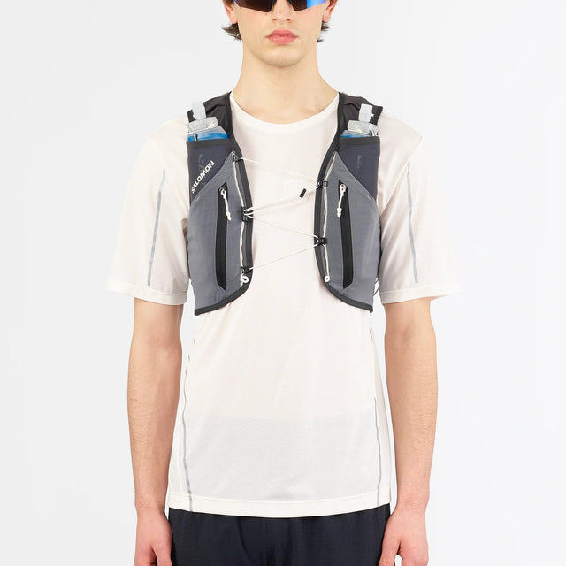 Front on-model view of green/grey Salomon ADV Skin 12 running vest