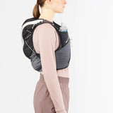 Side on-model view of green/grey Salomon ADV Skin 12 running vest