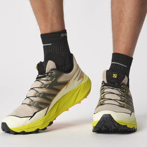 On-model view of men's salomon thundercross trail running shoes in safari/sulphur spring/black colour