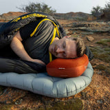 Lifestyle Sea to Summit Aeros premium Pillow in Picante colour model laying on pillow