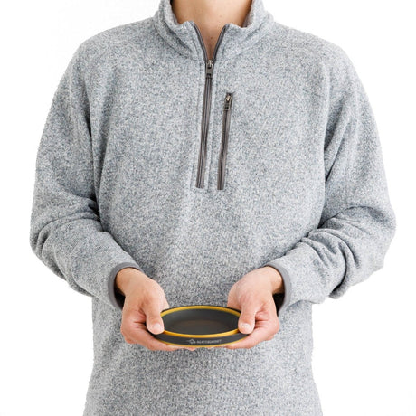 Model holding Sea to Summit Frontier Ultralight collapsible bowl