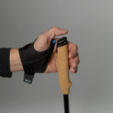 Hand wearing a Blueberry system black glove holding a Silva running pole
