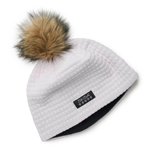 Flat lay view of 'Daybreak' (white/grey) skida Chateau Pom Hat