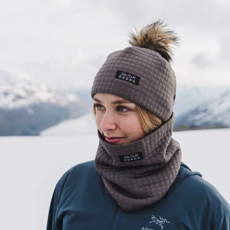 Model wearing skida Chateau Pom Hat in morel colour