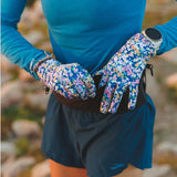 Model wearing pair of floral-patterned Skida gloves