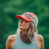 Model wearing Skida running cap in magpie print/colour
