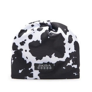 Skida running hat in Moo cow pattern