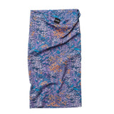Skida snow tour neck gaiter in purple/blue 'lullaby' pattern