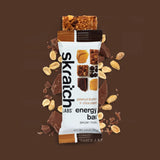 Skratch Labs peanut butter and chocolate energy bar on a brown background