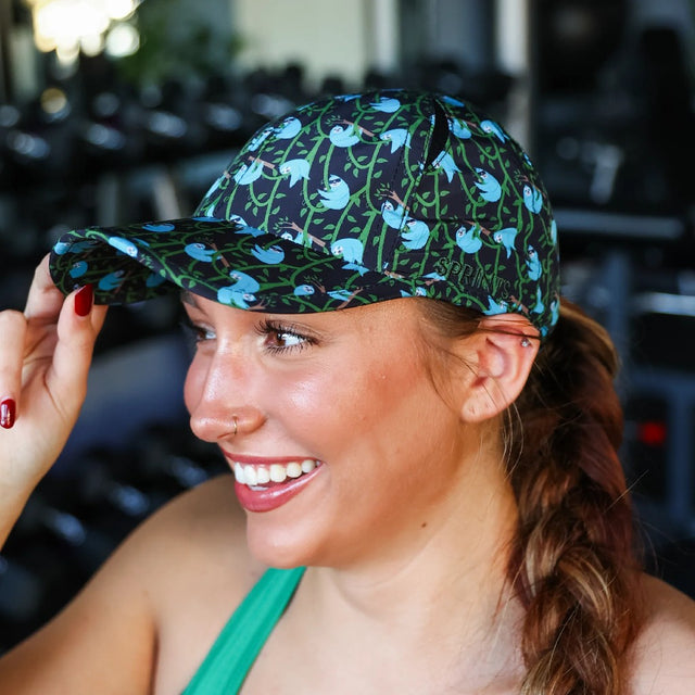 Woman wearing a Sprints OG hat with sloths pattern