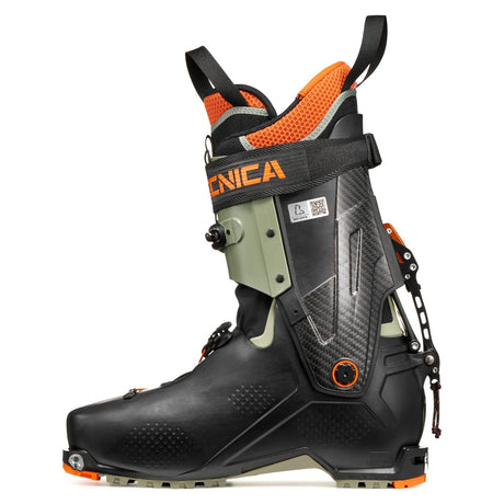 Inner side view of a green/orange Tecnica Zero G Peak Carbon backcountry ski boot