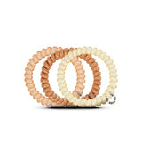 3 small Teleties hair ties in beige shades