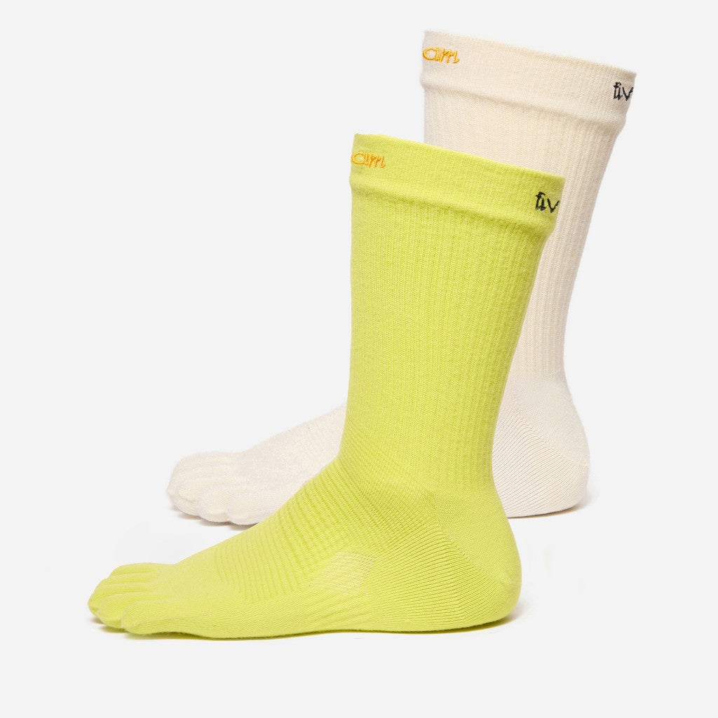 Two vibram toe socks, one yellow and one white