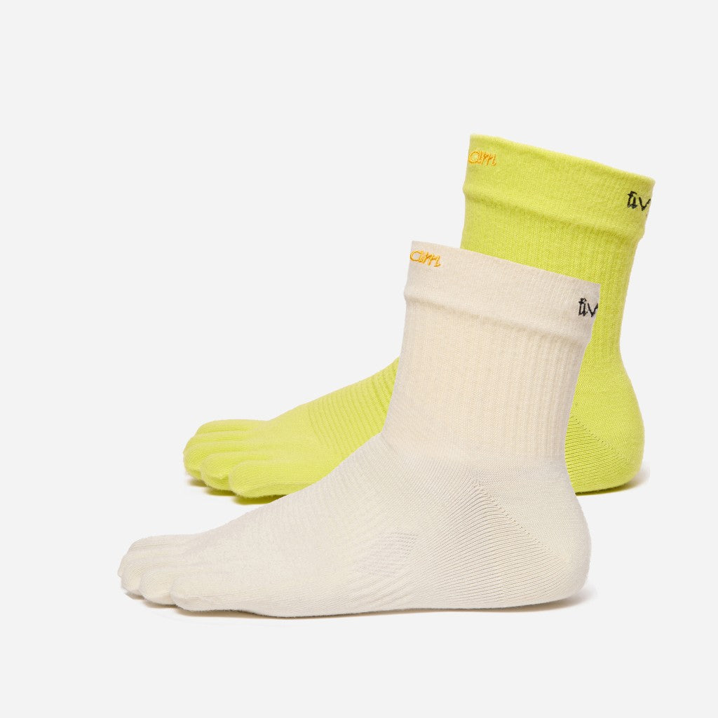 Two vibram mini crew toe-socks, one white and one yellow