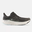 Side view of women's New Balance Fresh Foam X running shoe in Blacktop