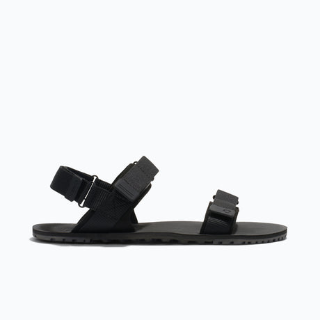 Side view of men's black Xero Shoes D-Trail minimalist sandal