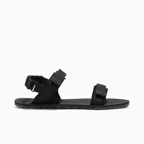 Side view of women's black Xero Shoes D-Trail minimalist sandal