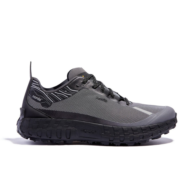 Side view of men's norda 001 G+ Spike winter trail running shoe in black