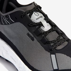 Lace details of men's norda 001 running shoe in black/black rubber